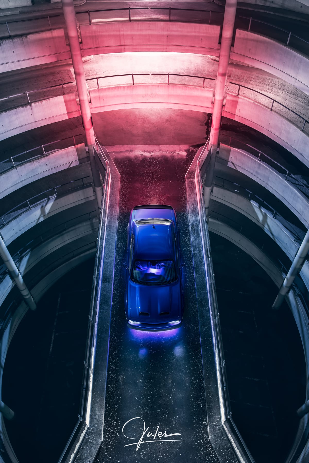 Top-down view of the car in a spiral parking ramp